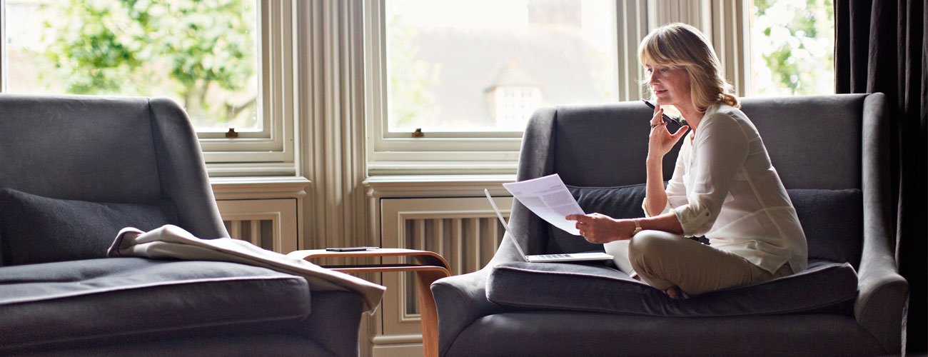 Woman sitting in chair reading